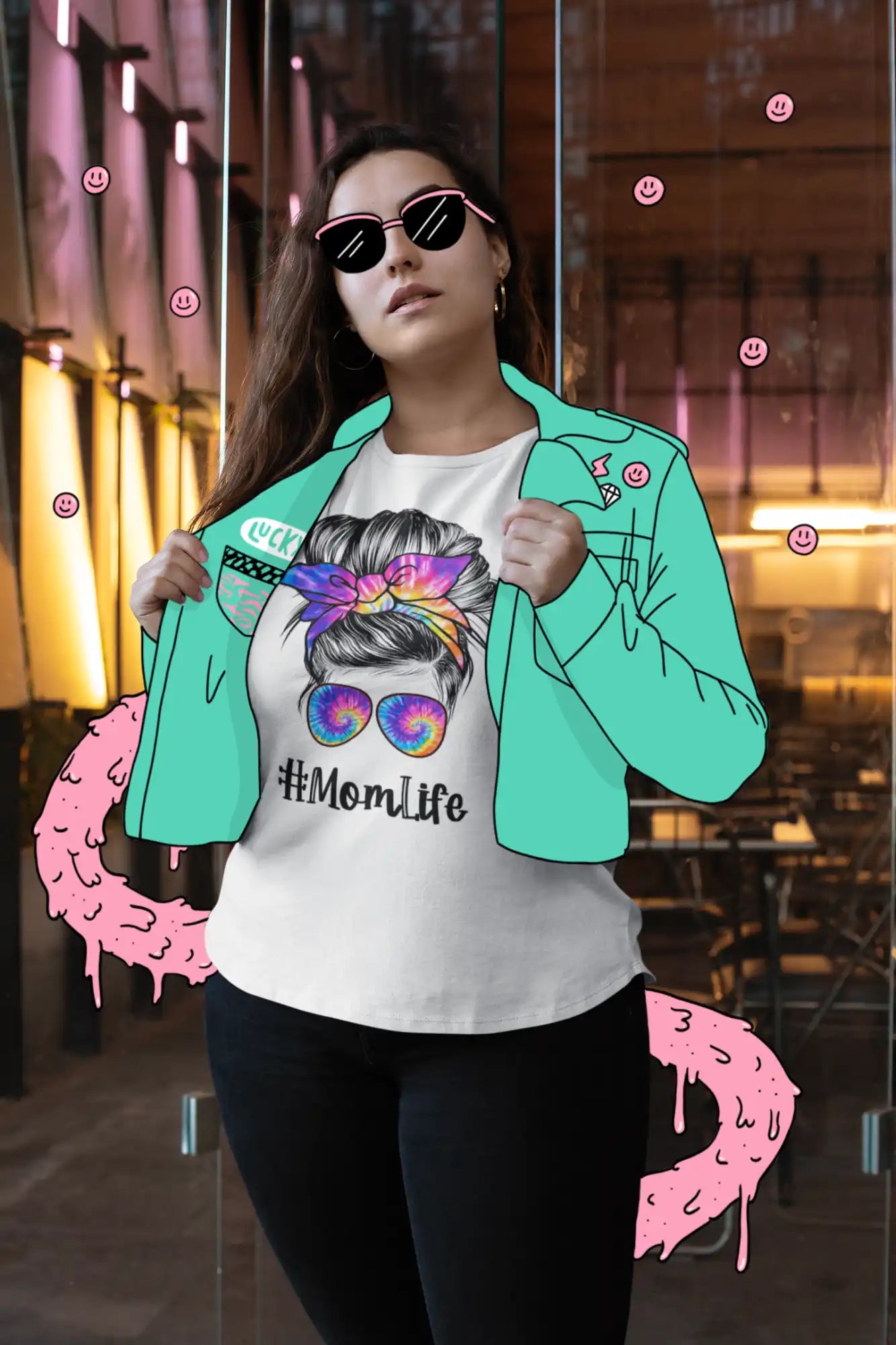 Woman wearing a #MomLife t-shirt and turquoise jacket.